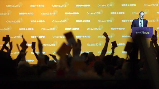 NDP delegates show hands as they vote on resolutions in Ottawa on Feb. 16, 2018.