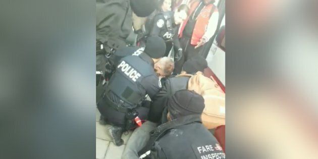 Toronto's transit authority is investigating after a video posted to Facebook showed five officers pinning down one young man.