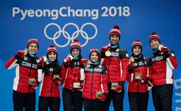 Patrick Chan, Gabrielle Daleman, Kaetlyn Osmond, Meagan Duhamel, Eric Radford, Tessa Virtue, and Scott Moir with their gold medals in the Team Skate on Feb, 12.