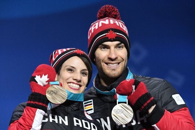 Meagan Duhamel and Eric Radford during the medal ceremony for the figure skating pair event at 2018 Olympics.