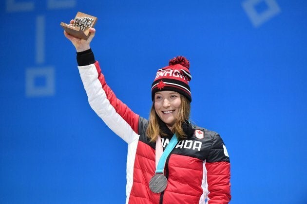 Canada's silver medalist Brittany Phelan poses on the podium during the medal ceremony for the freestyle skiing Women's skicross during the PyeongChang 2018 Winter Olympic Games on Feb. 23, 2018.