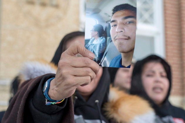 Debbie Baptiste, the mother of Colten Boushie, holds up a picture of her son.