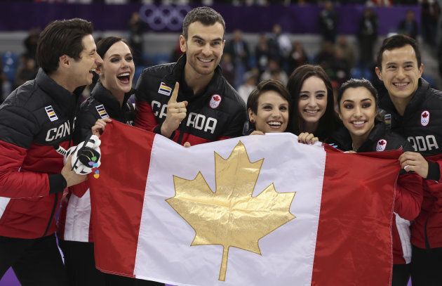 Team Canada celebrates their gold medal win in the figure skating team event at the PyeongChang Olympics on Feb. 11, 2018.