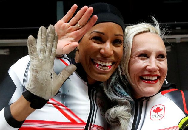 Phylicia George and Kaillie Humphries react to their bronze-medal in women's bobsled.