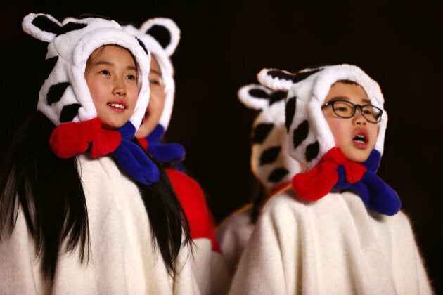 Children sing during the Closing Ceremony of the PyeongChang 2018 Winter Olympic Games.