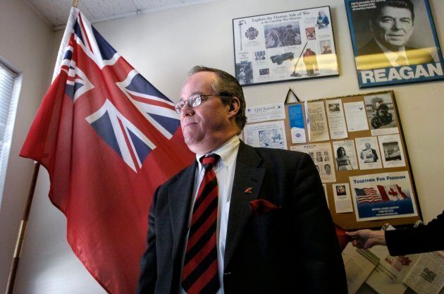 Paul Fromm poses in front of an Ontario flag in 2005. He's been linked to neo-Nazi groups in Canada and the United States.