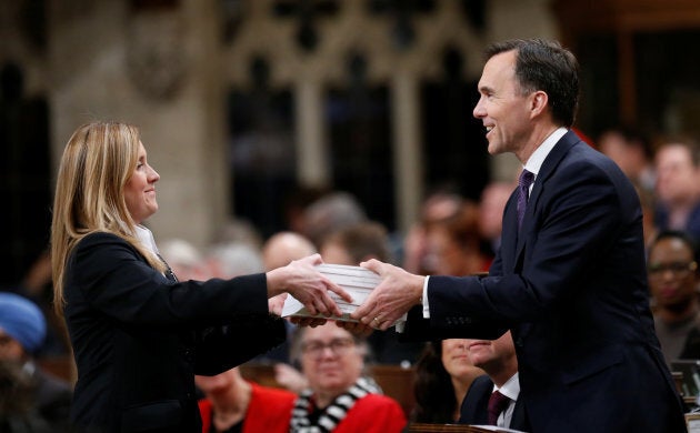 Finance Minister Bill Morneau, right, tables the 2018 federal budget in the House of Commons on Parliament Hill in Ottawa on Feb. 27, 2018. The budget was written with gender equality in mind.