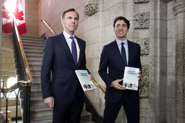Prime Minister Justin Trudeau, right, and Finance Minister Bill Morneau, left, arrive at the House of Commons before tabling the federal budget in Ottawa, on Feb. 27, 2018.