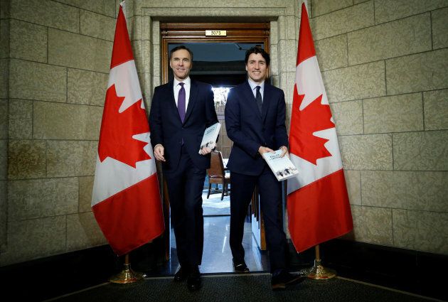 Prime Minister Justin Trudeau and Finance Minister Bill Morneau walk from Trudeau's office to the House of Commons to deliver the budget on Parliament Hill in Ottawa on Feb. 27, 2018.