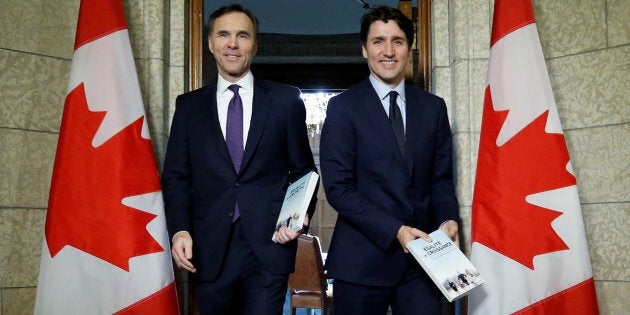 Prime Minister Justin Trudeau and Finance Minister Bill Morneau walk from Trudeau's office to the House of Commons to deliver the budget on Parliament Hill in Ottawa on Feb. 27, 2018.