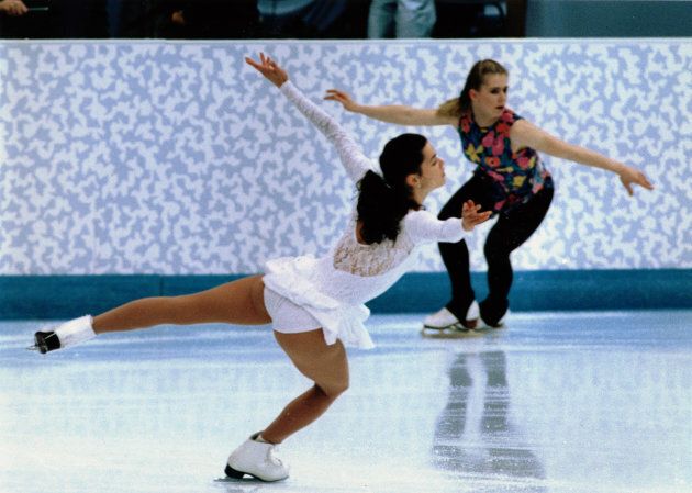 Nancy Kerrigan and Tonya Harding skate during a practice session at the 1994 Lillehammer Olympics.