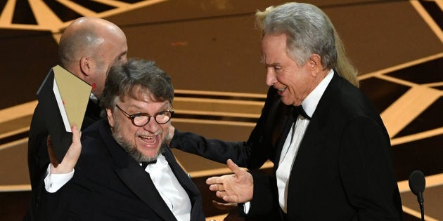 Director Guillermo del Toro (L) accepts Best Picture for 'The Shape of Water' from actor Warren Beatty onstage during the 90th Annual Academy Awards on March 4, 2018.