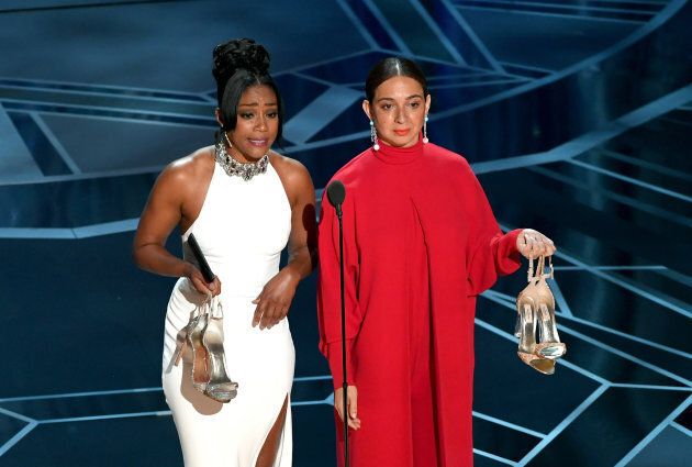 Actors Tiffany Haddish (L) and Maya Rudolph speak onstage during the 90th Annual Academy Awards.