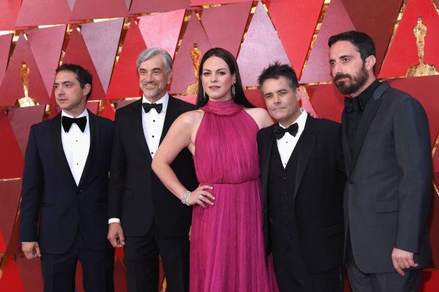 (L-R) Producer Juan de Dios Larrain, producer Francisco Reyes Morande, actress Daniela Vega, director Sebastian Lelio, and producer Pablo Larrain attend the 90th Annual Academy Awards on March 4, 2018.