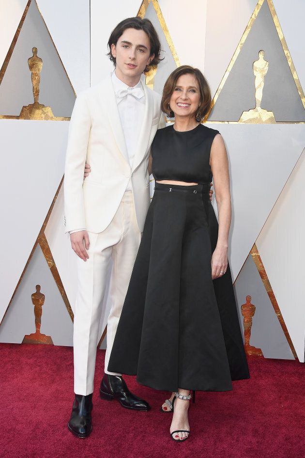 Timothee Chalamet and his mom, Nicole Flender, pose on the Oscars red carpet.