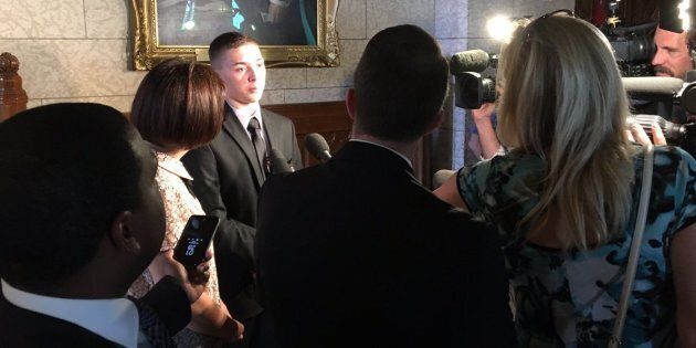 Noah Irvine speaks to reporters in the House of Commons in 2017.