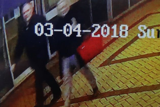 A journalist shows CCTV footage on a mobile phone believed to show Sergei Skripal, 66 and his duaghter Yulia Skripal, in her 30s, who were found unconscious in Salisbury town centre on March 6, 2018 in Salisbury, England.