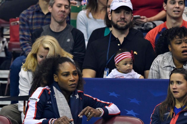 Serena Williams bottom left, along with her husband Alexis Ohanian and their daughter Alexis Olympia, center, at the 2018 Fed Cup at US Cellular Center on February 10, 2018.