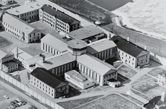 (Original Caption) Kingston, Ontario, Canada: Aerial view shows the area that is under siege by some 400 inmates at the Kingston Penitentiary. The four-way cell block in the middle is the area where prisoners are holding six guards hostage till the prison meets their demands. UPI Telephoto.
