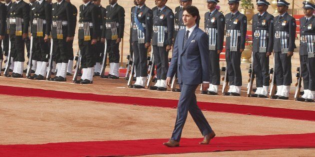 Prime Minister Justin Trudeau inspects a guard of honour during a ceremonial reception at the presidential estate in New Delhi, India, on Feb. 23, 2018.