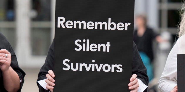 A mourner stands at the courthouse in Pembroke, Ont. on Sept. 23, 2015, as Basil Borutski, 57, was set to appear in court. The director of a local sexual assault centre says that Borutski's crime woke people up to the reality of violence against women.