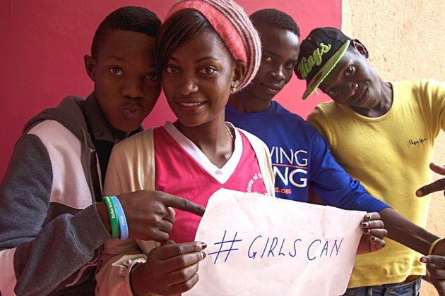 Young people in Uganda participate in a youth club which promotes girls' rights.