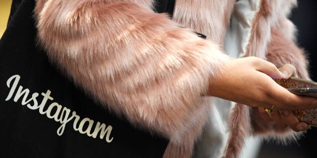 A woman carries an Instagram branded bag at Facebook's headquarters in London, Britain, December 4, 2017.