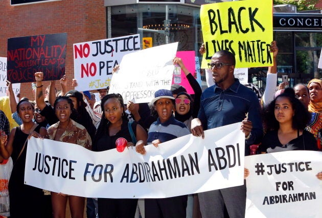 People assemble to honour Abdirahman Abdi in a protest at Ottawa's police headquarters on July 30, 2016.