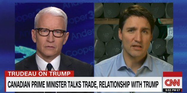 Anderson Cooper and Prime Minister Justin Trudeau are shown in a screegrab from
