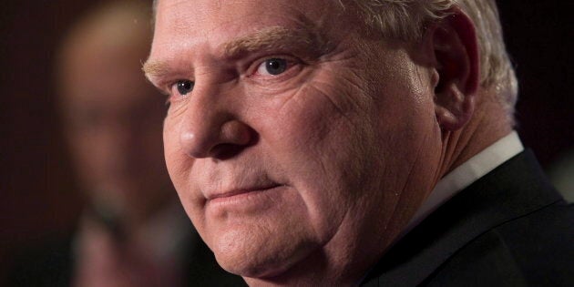 Doug Ford scrums with journalists at the TVO studios in Toronto on Feb. 15, 2018, following a televised Ontario PC leadership debate.