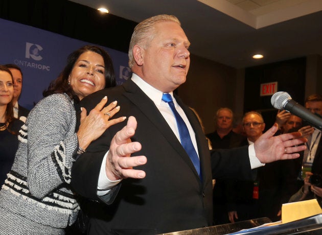 Progressive Conservatives leadership race candidate winner Doug Ford speaks with his wife Karla in Markham, Ontario, on March 10, 2018.