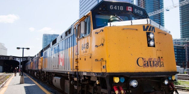 A VIA rail train waits in the station.