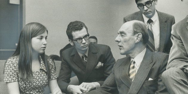 Opposition leader Robert Stanfield sits with Sally Caldwell, 18, David Armstrong, 18, and Gary Nicoll, 18, after speaking at York Mills Collegiate on April 6, 1970. Stanfield got a standing ovation after telling 1,200 students he believed the federal voting age would be lowered before the next election.