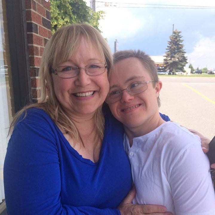 Today, Joshua MacDonald (right) is 21. His mother Karen (left) says he's "strong as an ox."