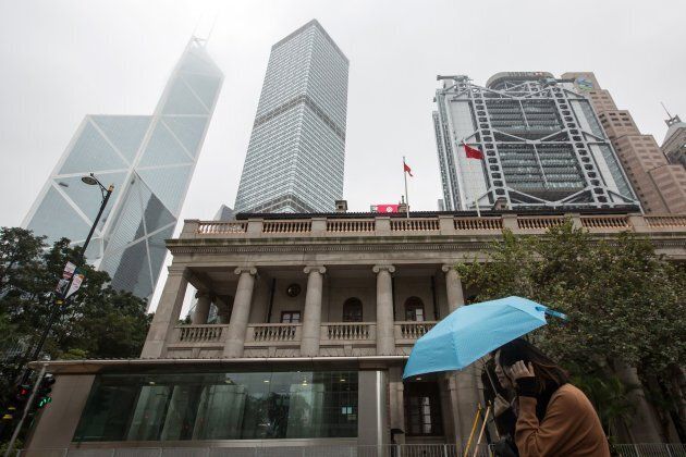 This picture taken on Jan. 6, 2018 shows a pedestrian walking past the Hong Kong Court of Final Appeal building in Hong Kong.