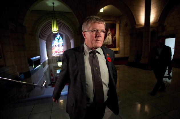 Conservative Sen. Don Plett arrives at the Senate on Parliament Hill in Ottawa on Oct. 28, 2013.