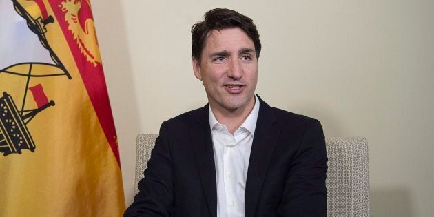 Prime Minister Justin Trudeau talks with reporters in Sussex, N.B. on March 22, 2018.