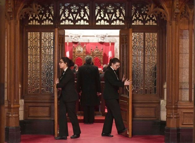 Senate pages close the doors before a vote on Bill C-45, the Cannabis Act, on Parliament Hill in Ottawa on Thursday.