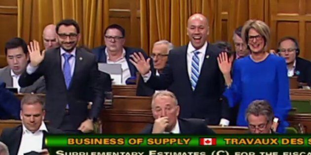 Liberal MPs Omar Alghabra, Andy Fillmore, and Pam Goldsmith-Jones wave at the camera during a procedural vote on March 22, 2018.