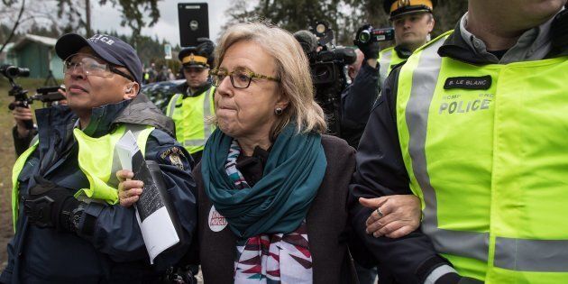 Federal Green Party Leader Elizabeth May is arrested by RCMP officers after joining protesters outside Kinder Morgan's facility in Burnaby, B.C. on March 23, 2018.