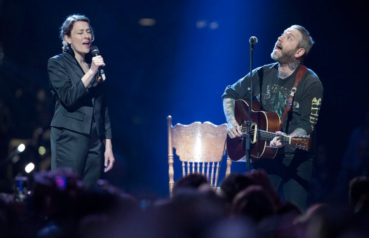 Sarah Harmer, left, and Dallas Green perform The Tragically Hip's "Bobcaygeon."