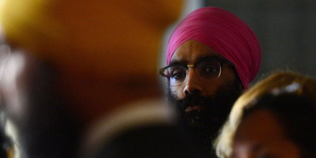 NDP Leader Jagmeet Singh, left, holds a press conference on Parliament Hill in Ottawa on Wednesday, Oct. 18, 2017, as his brother Gurratan Singh looks on.