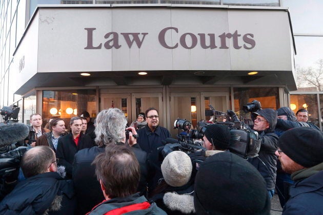 Chief Kevin Hart, centre, speaks to media outside the law courts in Winnipeg after the jury delivered a not-guilty verdict in the second-degree murder trial of Raymond Cormier, Feb. 22, 2018.