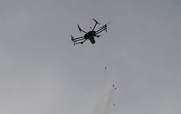 An Israeli drone drops tear gas grenades during clashes with Palestinian protesters east of Gaza City on March 30, 2018.