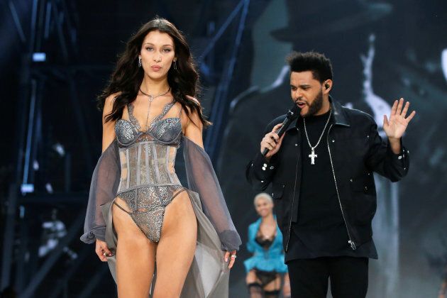 Awkward: Bella Hadid walks the Victoria's Secret Fashion Show runway, while ex The Weeknd performs, at the Grand Palais in Paris, France on Nov. 30, 2016.