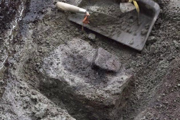 Dozens of ancient footprints, one of which is shown at the dig site on a British Columbia island, have been confirmed as the earliest known of their kind in North America.