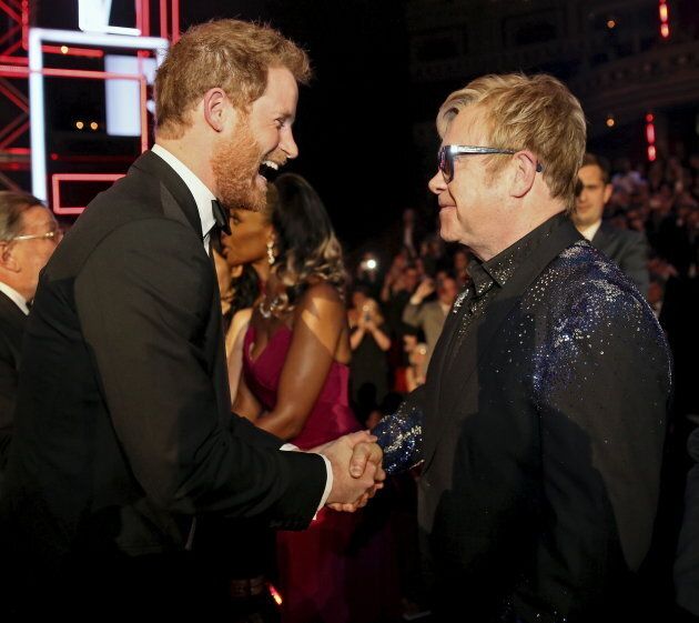 Prince Harry greets Elton John after the Royal Variety Performance at the Albert Hall in London on Nov. 13, 2015.