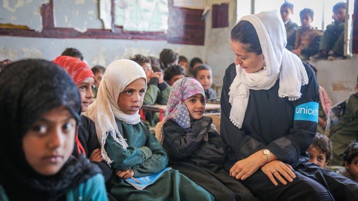 On 27 March 2018 in the Aldailami School, Belad Alroos district, Sana'a, Yemen, UNICEF Representative in Yemen Merixell Relano (with white scarf) speaks with girl students. Nearly half a million children have dropped out of school since the 2015 escalation of conflict in Yemen, bringing the total number of out-of-school children to 2 million.