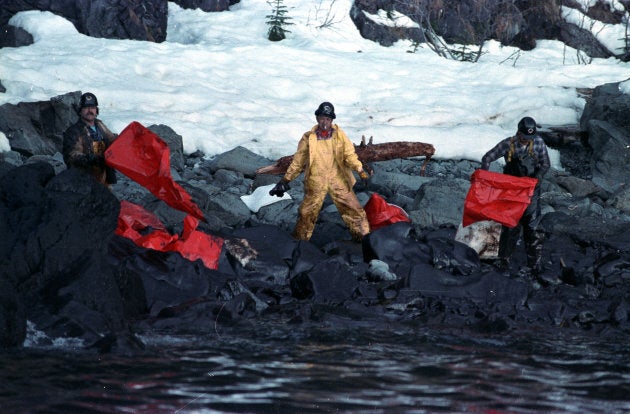 Crews clean up the oil soaked beach on Naked Island in the Prince William Sound off the coast of Alaska on April 2, 1989 after the Exxon Valdez oil spill.