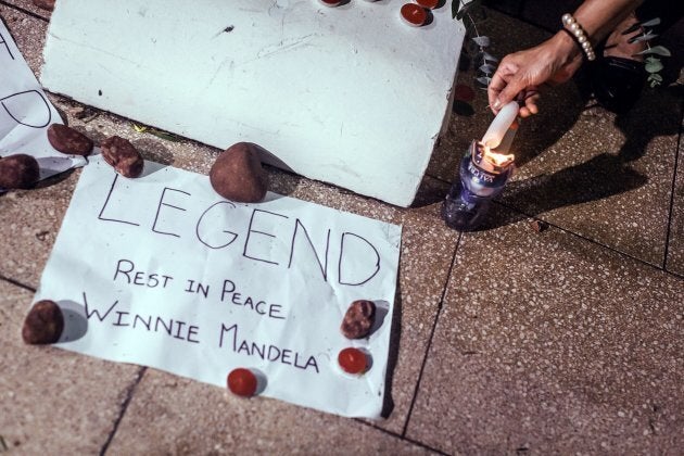 A message is left near the Old Durban Prison's Human Rights wall as South Africans gather to pay their respects to the late high-profile anti-apartheid activist Winnie Madikizela-Mandela during a candle vigil in Durban on April 2, 2018.